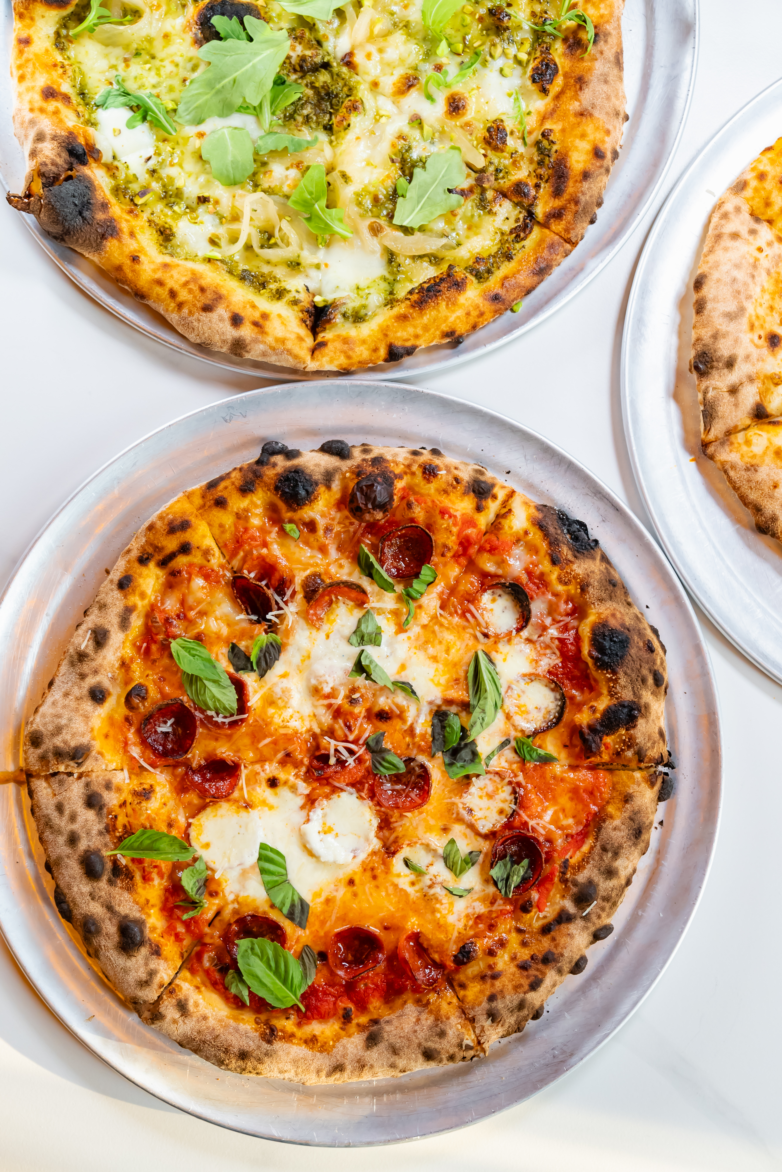 a pizza sitting on top of a plate of food