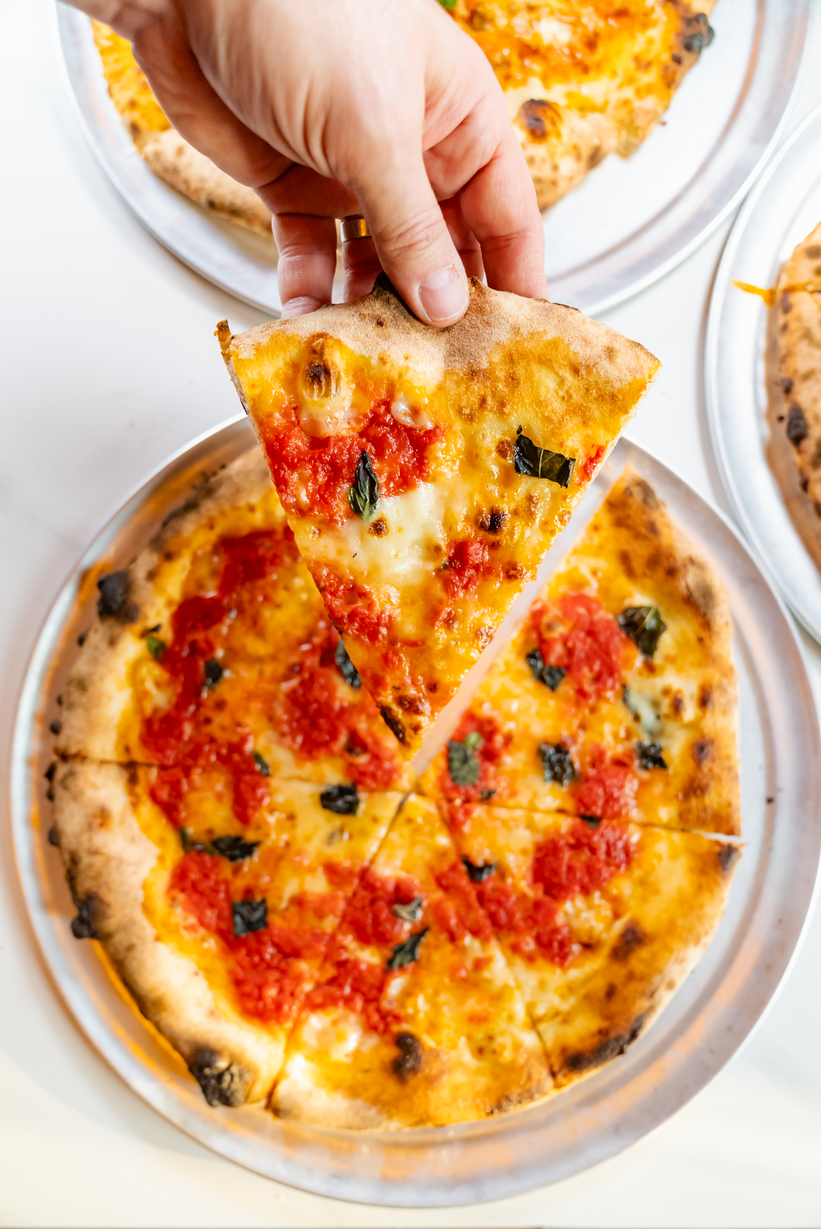 a pizza sitting on top of a plate of food
