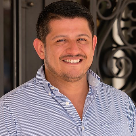 a man smiling for the camera