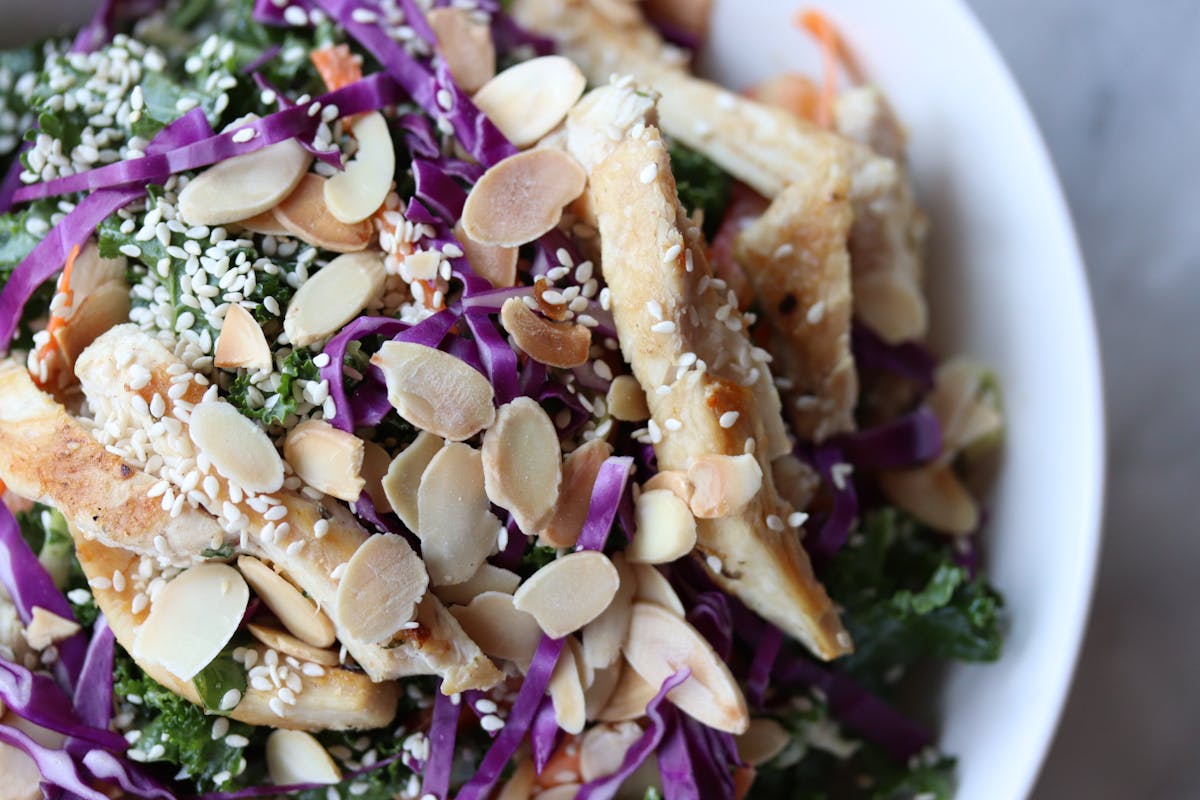 a close up of a bowl of salad