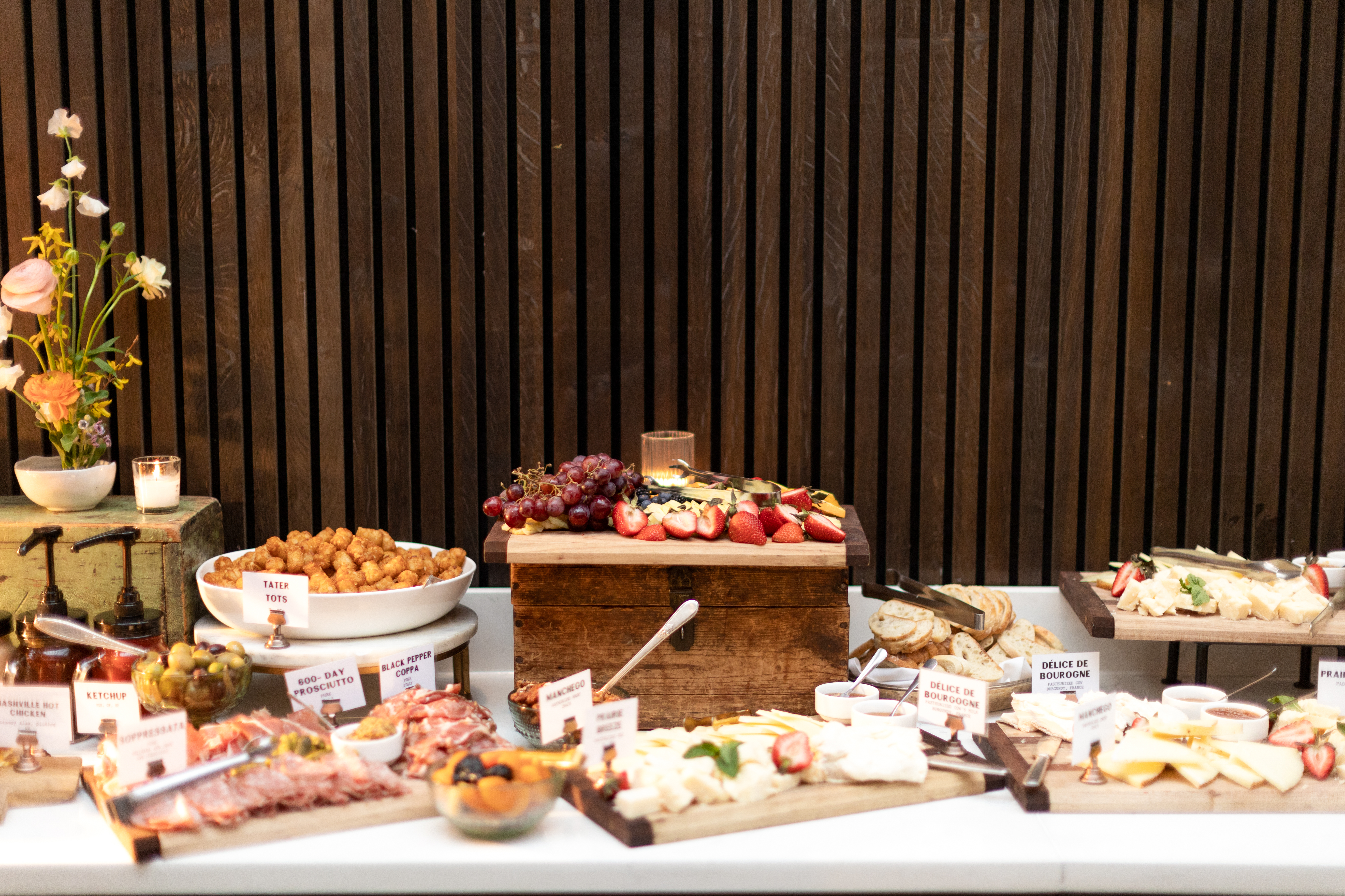 Cocktail hour food stations apart of an all inclusive wedding package at an urban winery wedding venue with customizable culinary menus