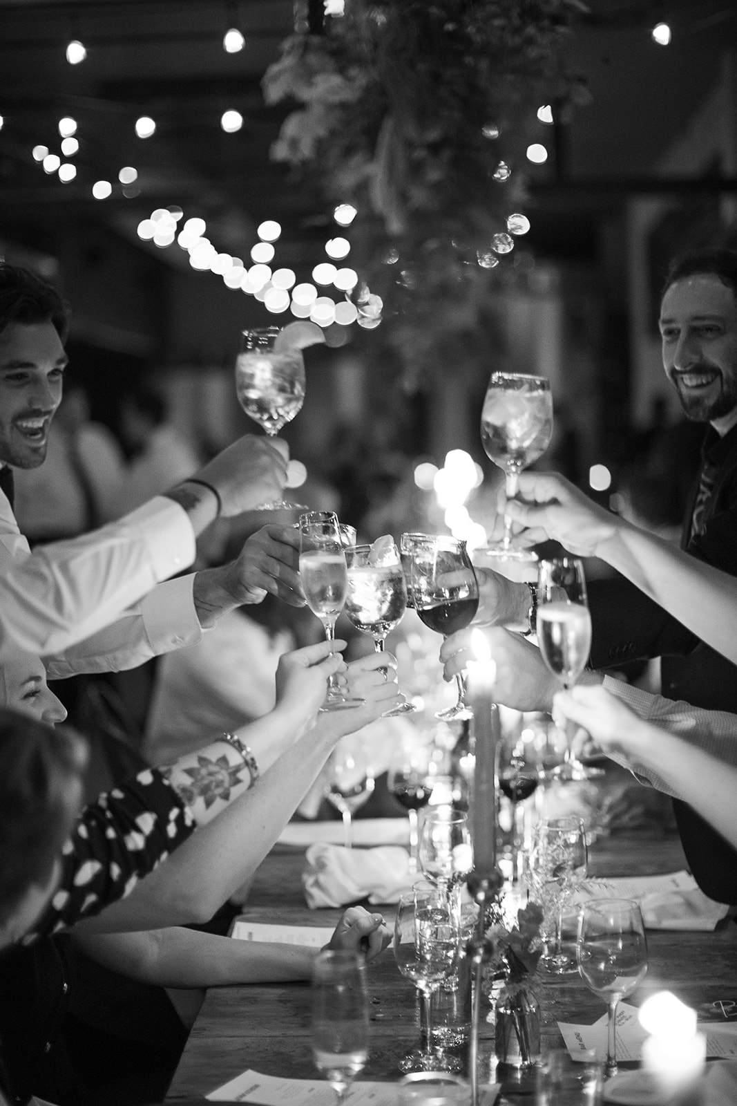 a group of people sitting at a table with wine glasses
