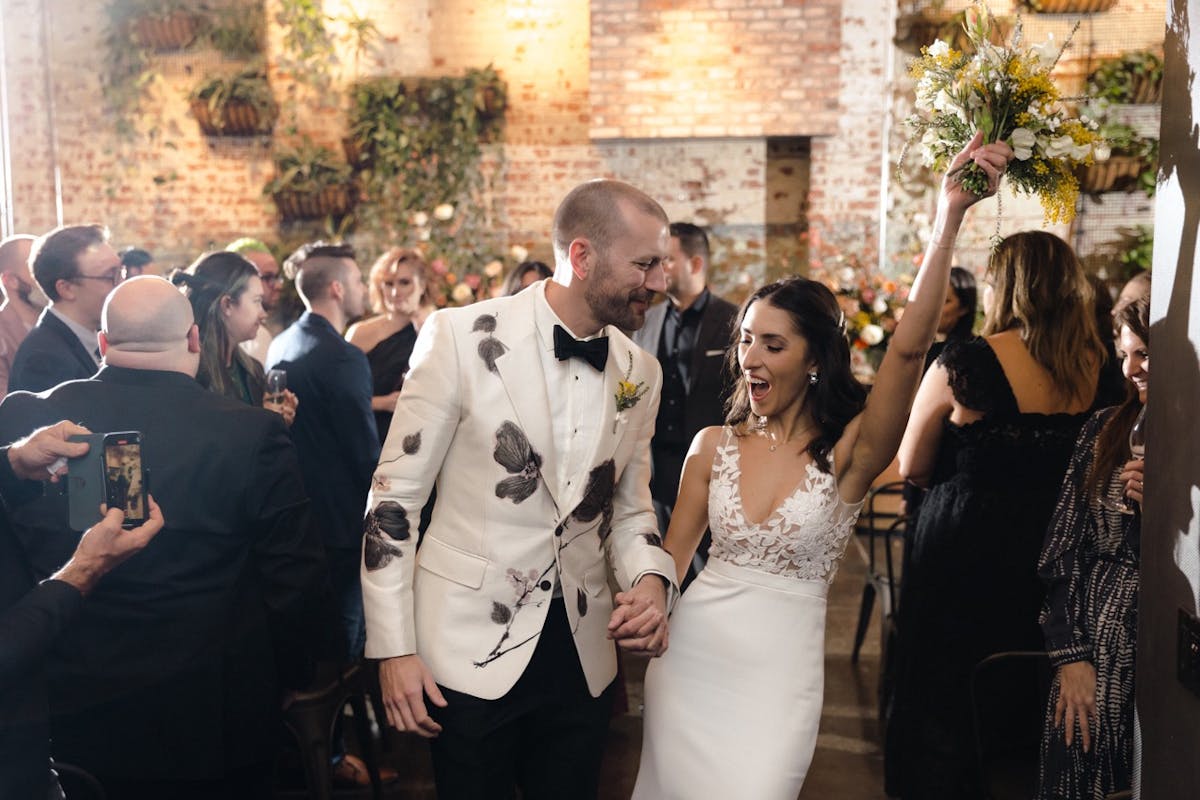 a group of people standing in front of a building
