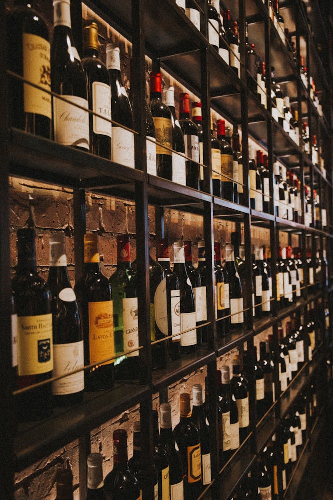 a store shelf filled with wine glasses