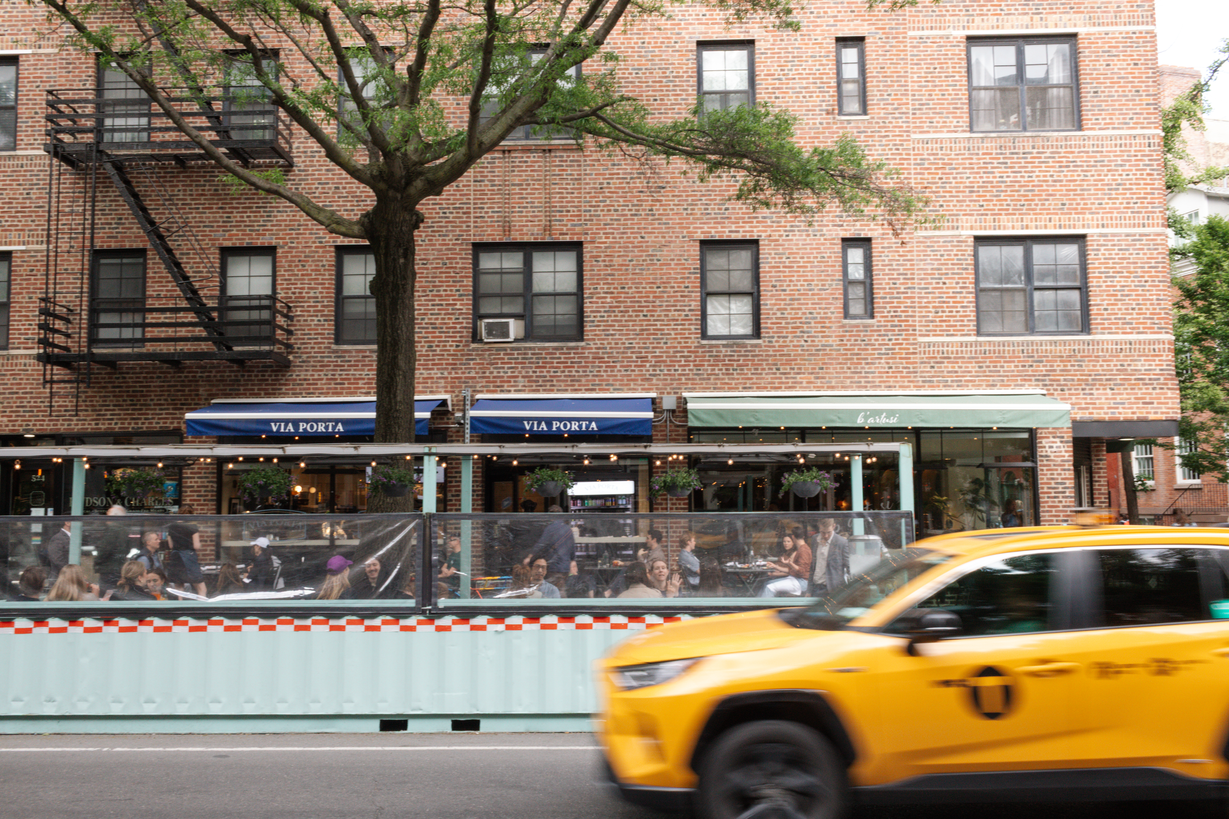a yellow taxi on the street