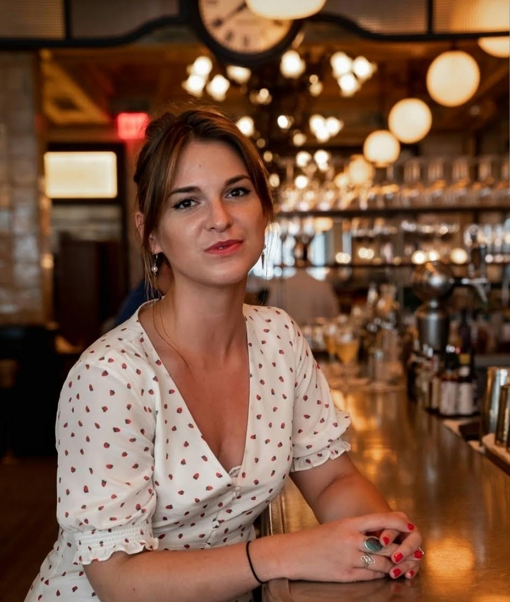 a person sitting at a table in a restaurant