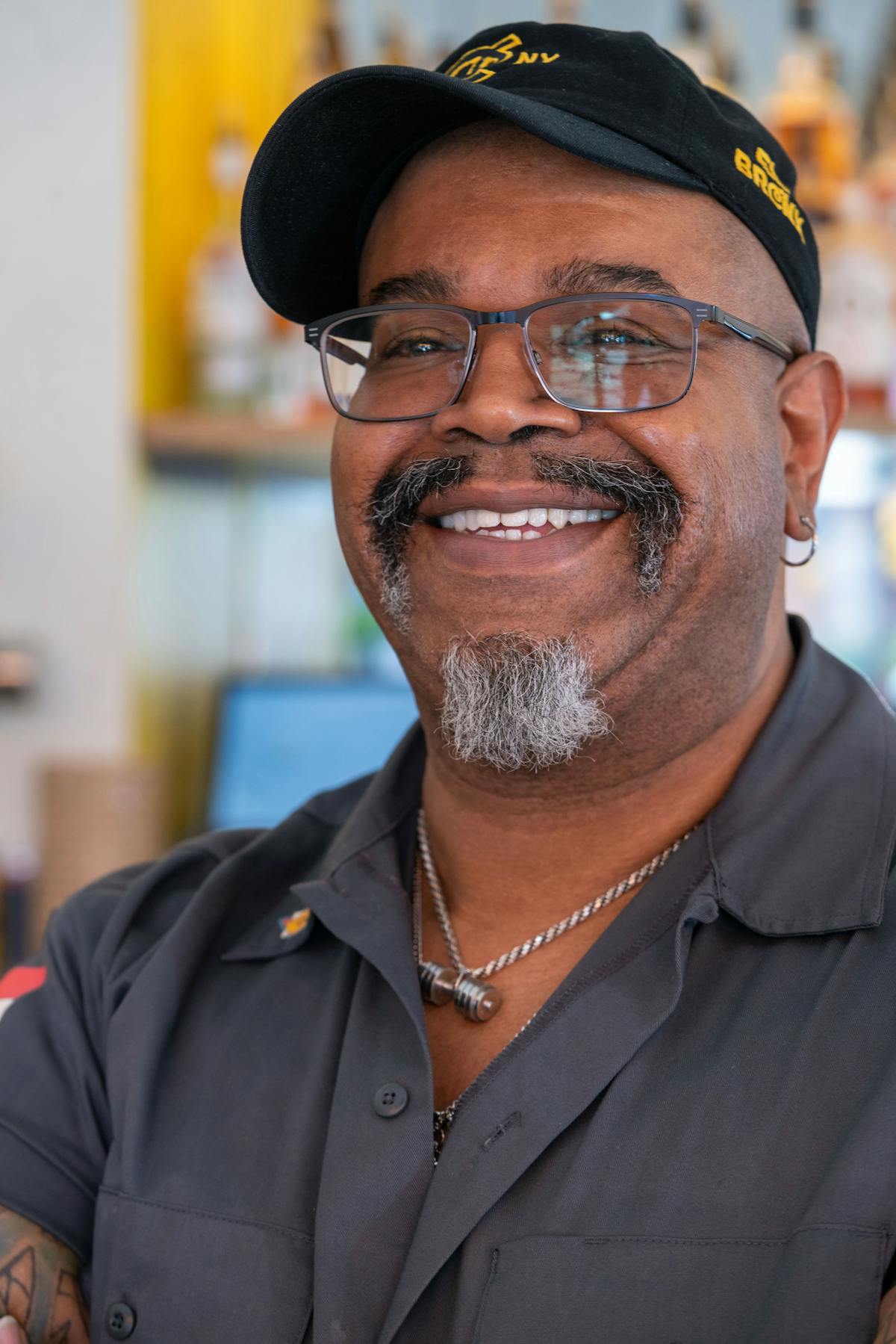 a man wearing a hat and glasses