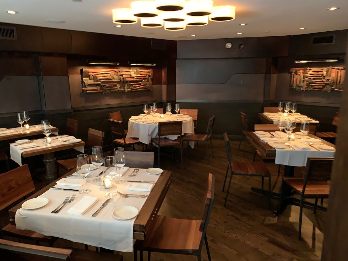 a kitchen with a table in a restaurant