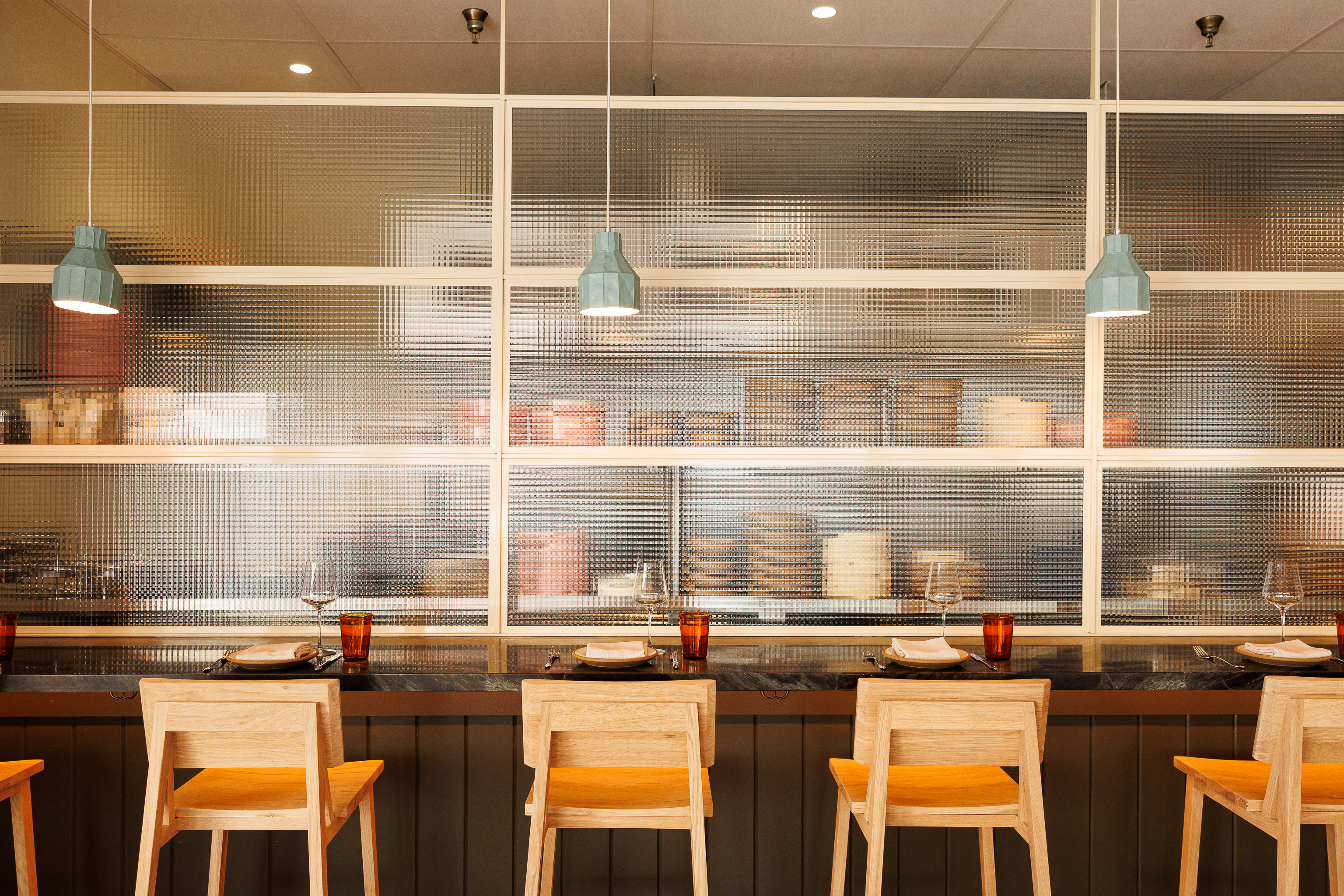 a vase of flowers sits in front of a window