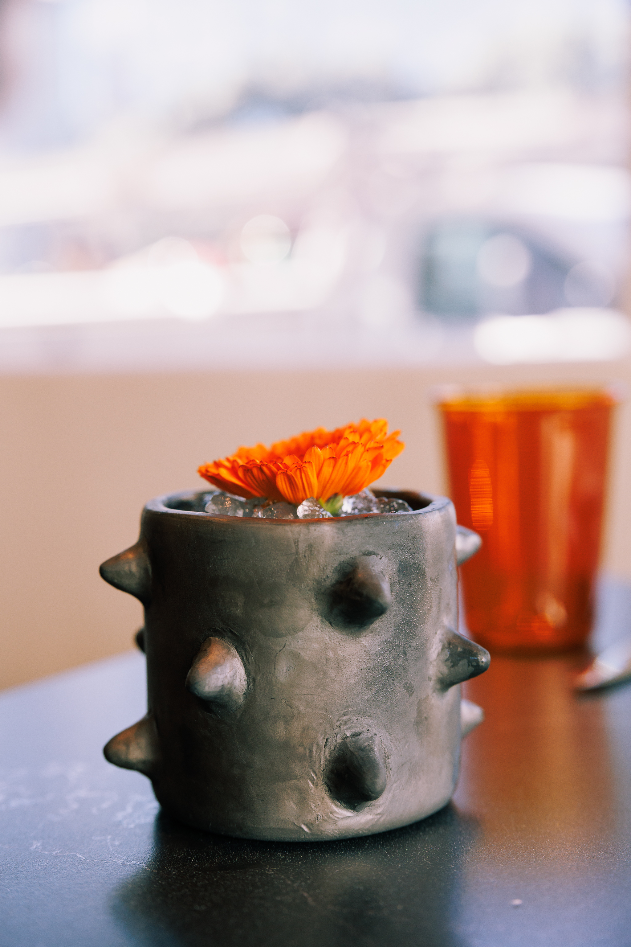 a close up of a vase on a table
