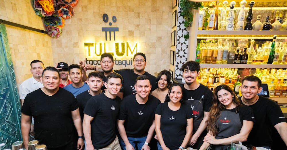 a group of people posing for a photo