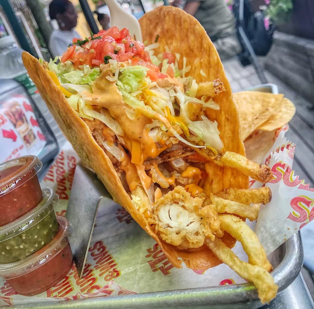 a close up of a plate of hot dogs and french fries