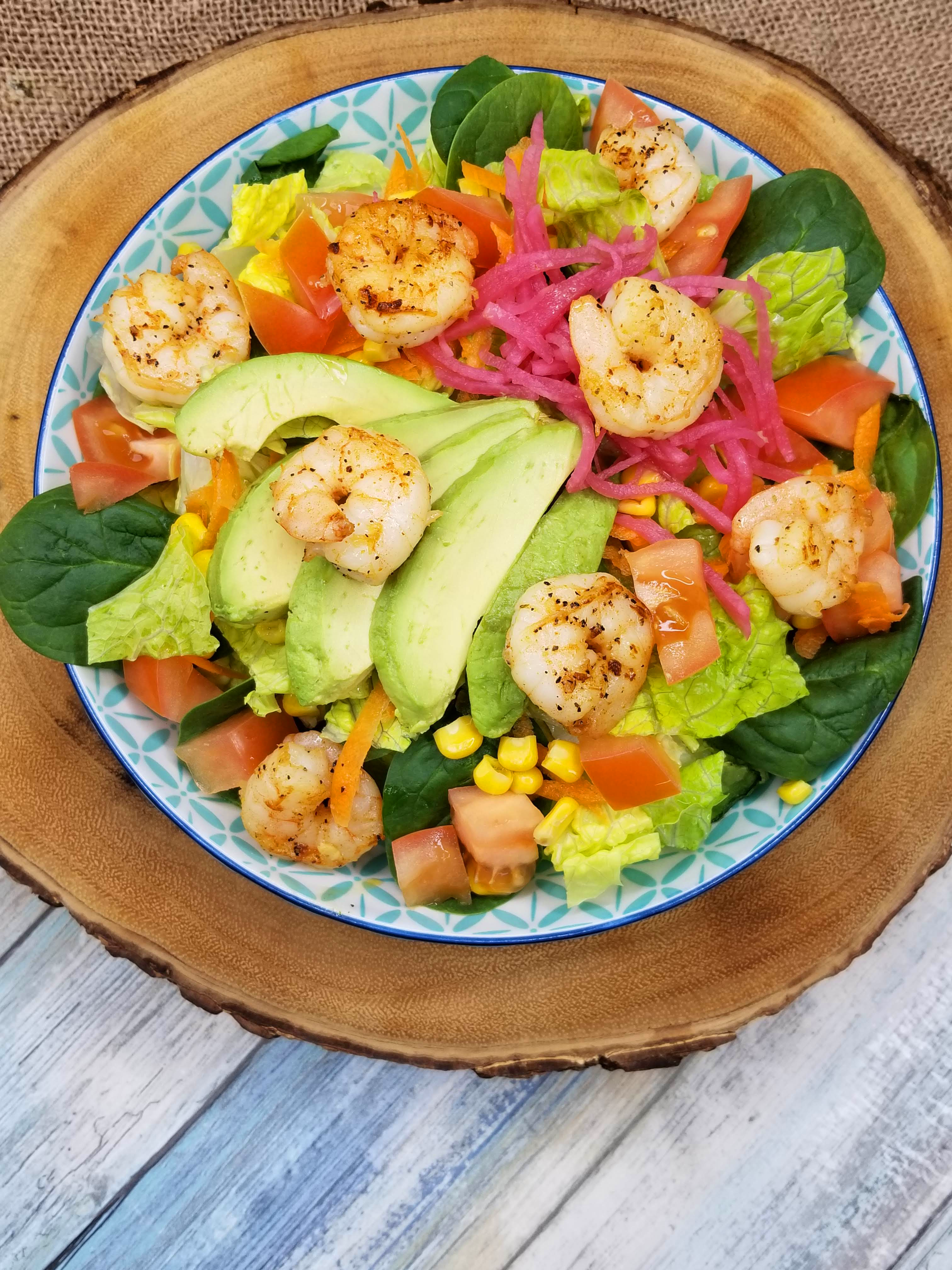 a plate of food on a wooden table
