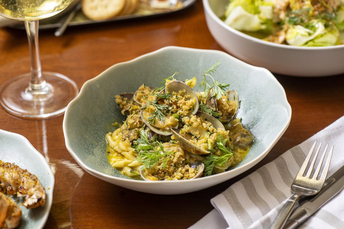 a bowl of food sitting on a table