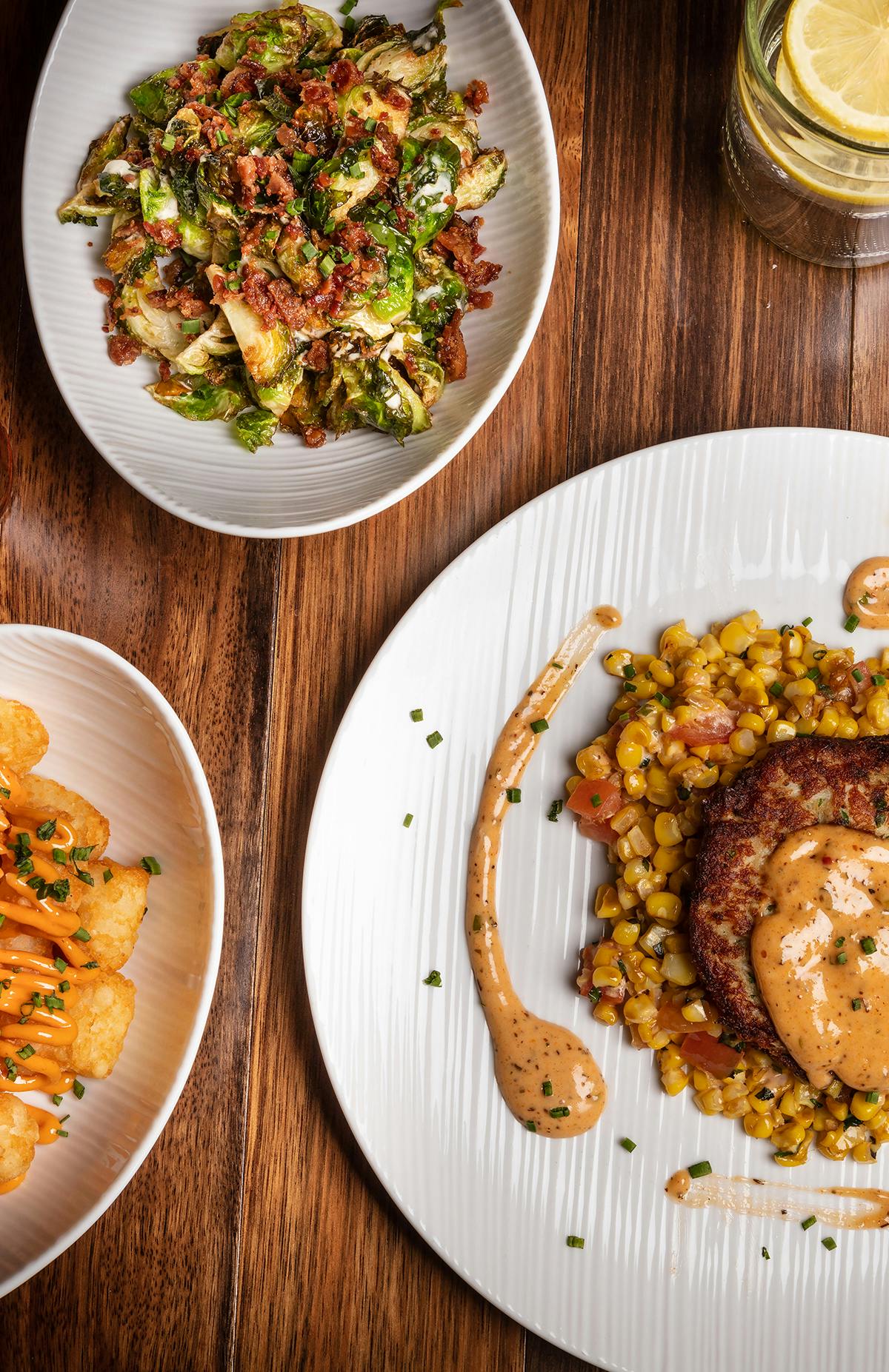 a plate of food sitting on top of a wooden table