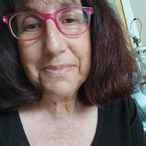 a close up of a person wearing glasses