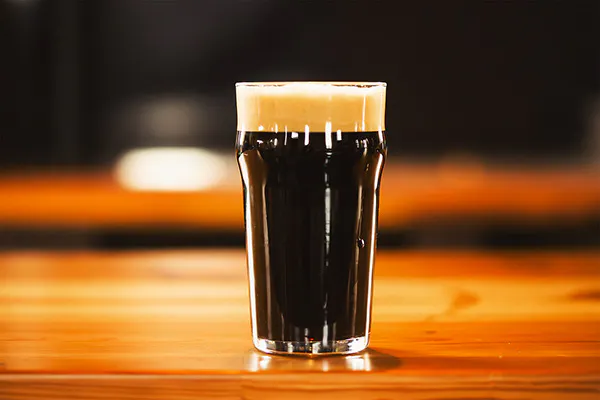 a hand holding a glass of wine