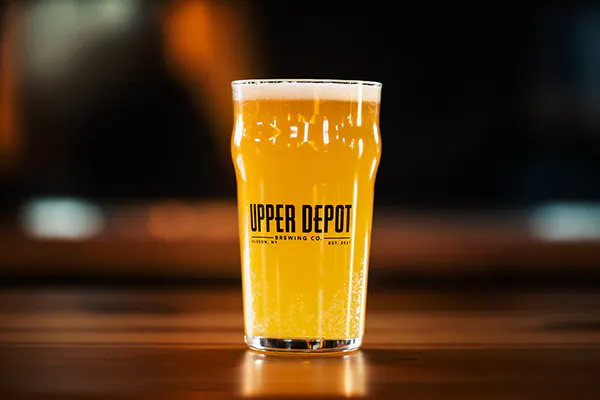 a hand holding a glass of wine