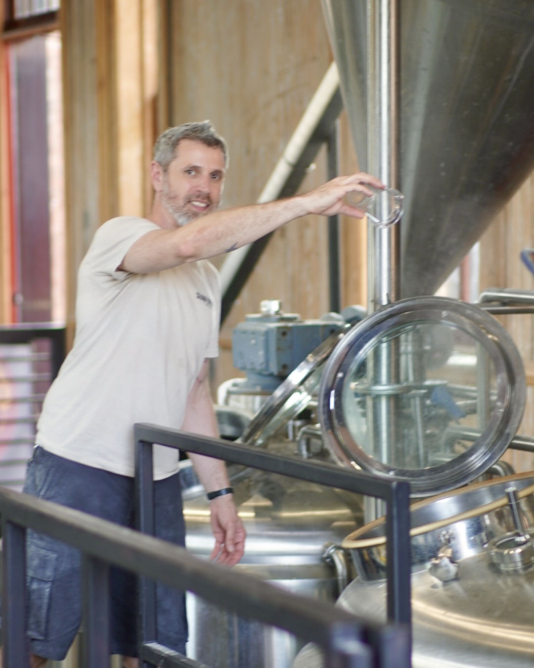 a man standing next to a machine