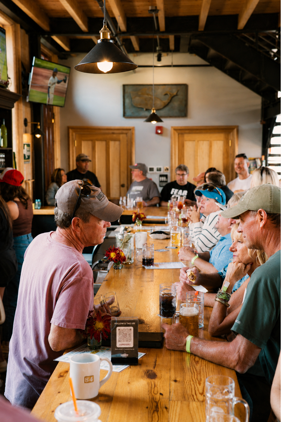 Pete Goldman visiting with customers talking about beer. Upper Depot Brewing Co., Hudson NY
