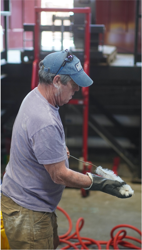 Pete Goldman cleaning during a brew day at Upper Depot Brewing.