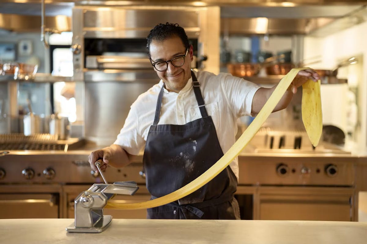 a man standing in a kitchen
