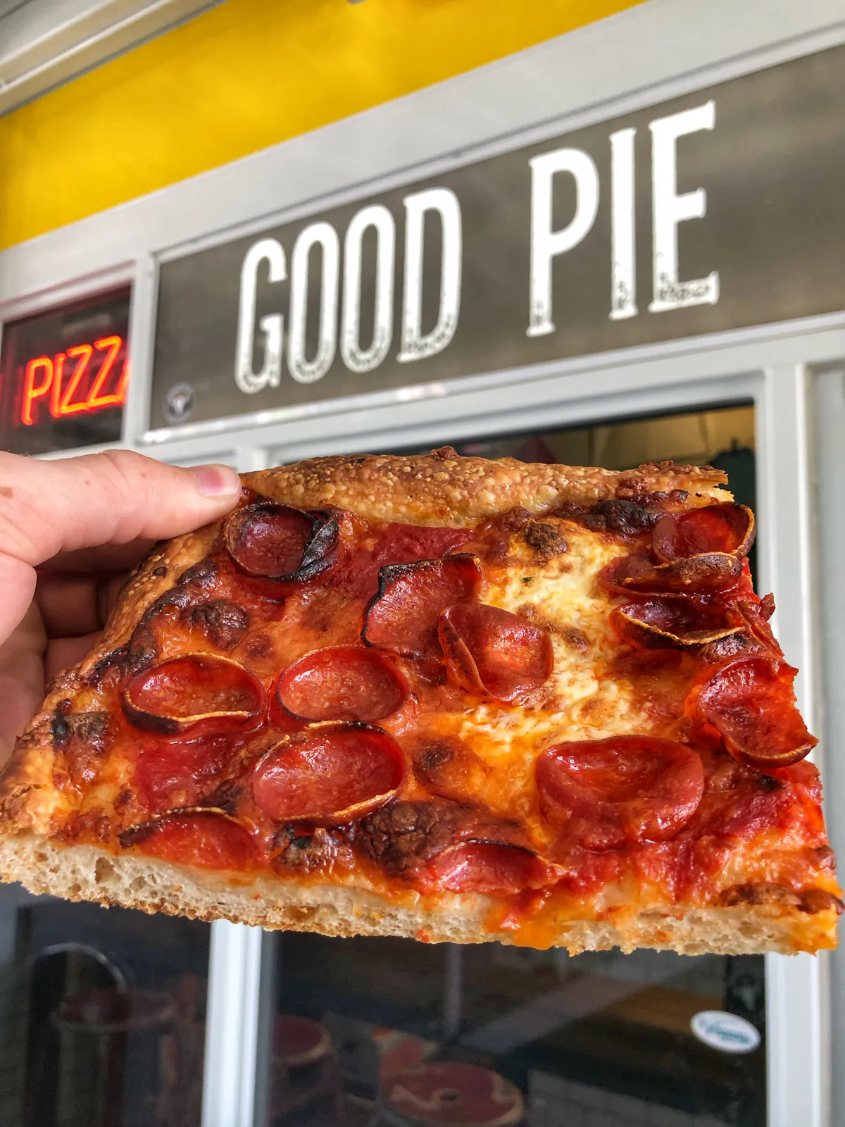 a close up of a slice of pizza