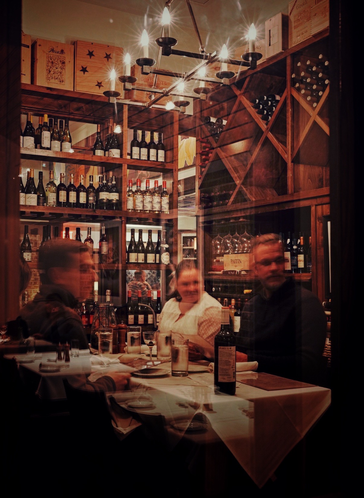 People having fun in the wine room at Osteria Mattone.