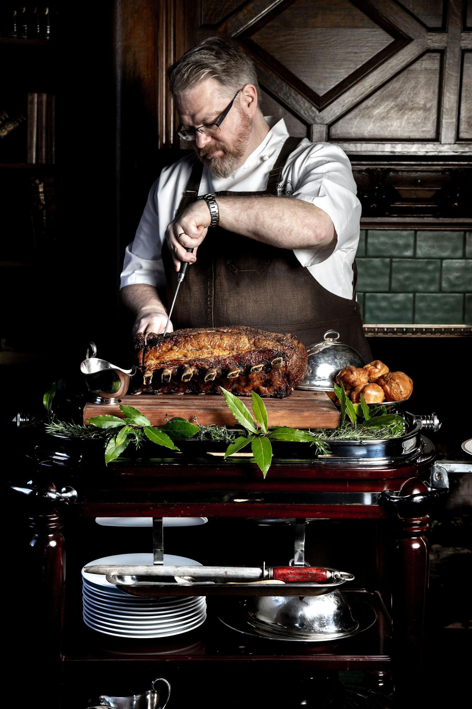 a man cooking food on a table