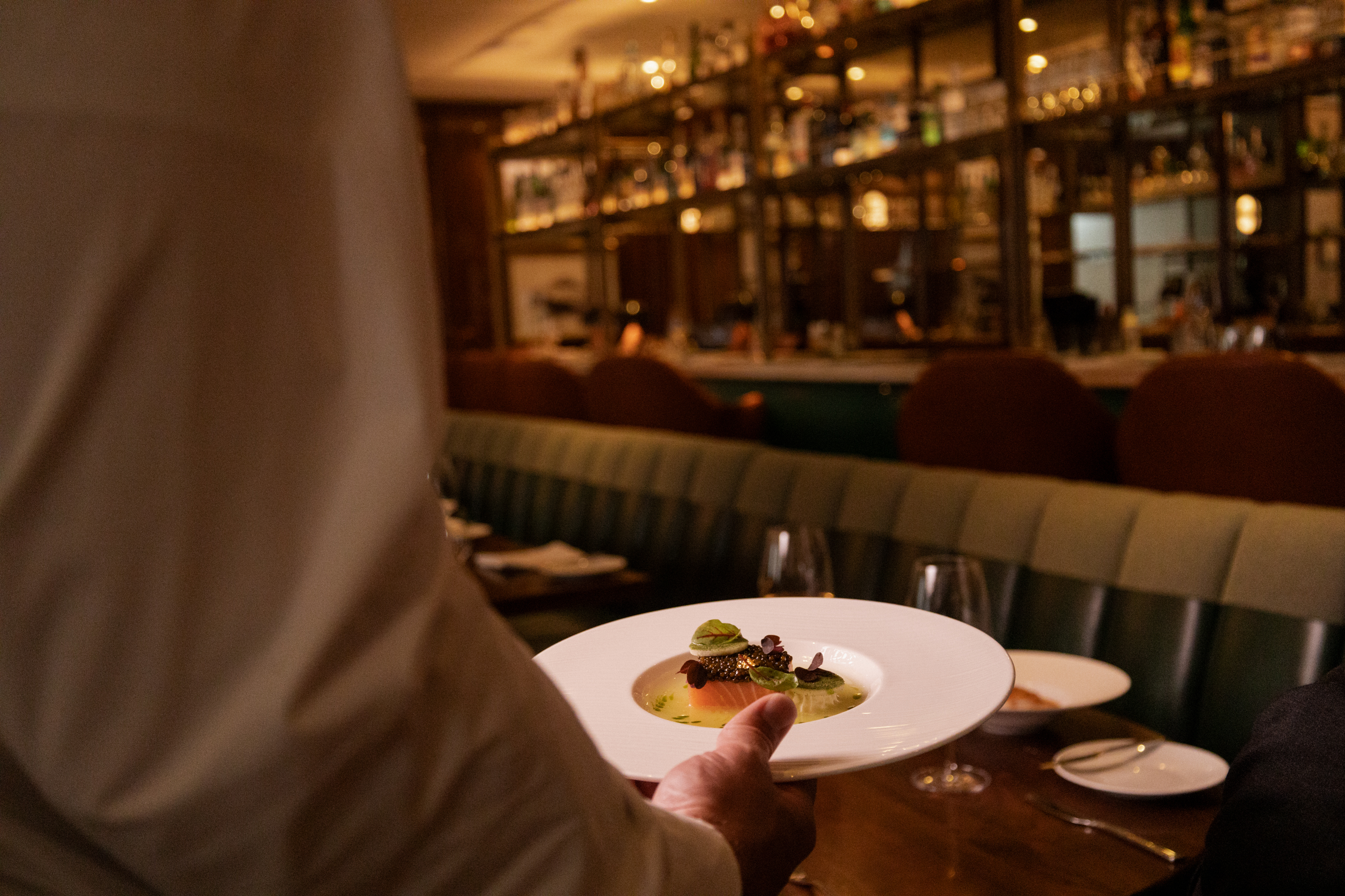 a person holding a plate of food