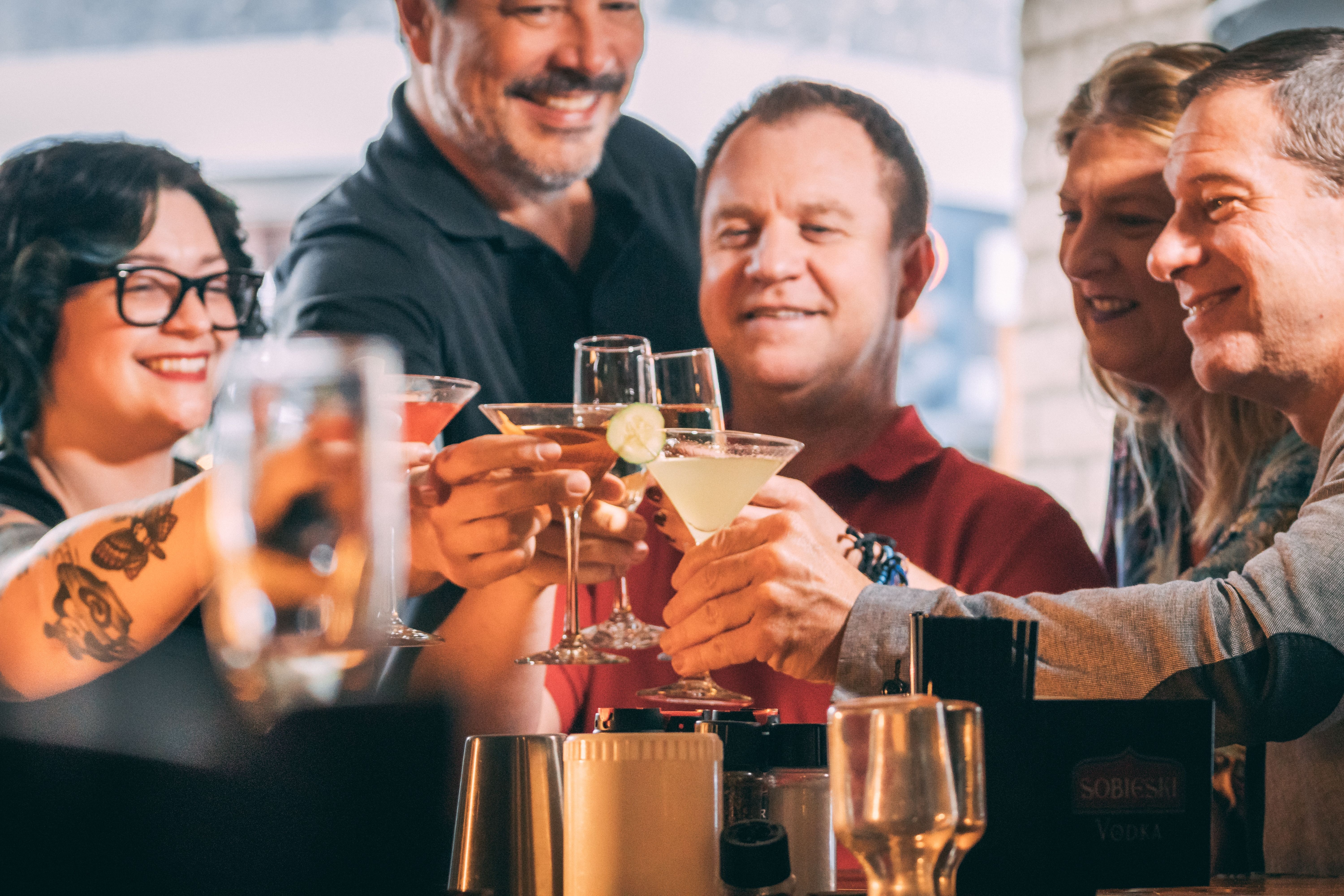 a group of people holding glasses