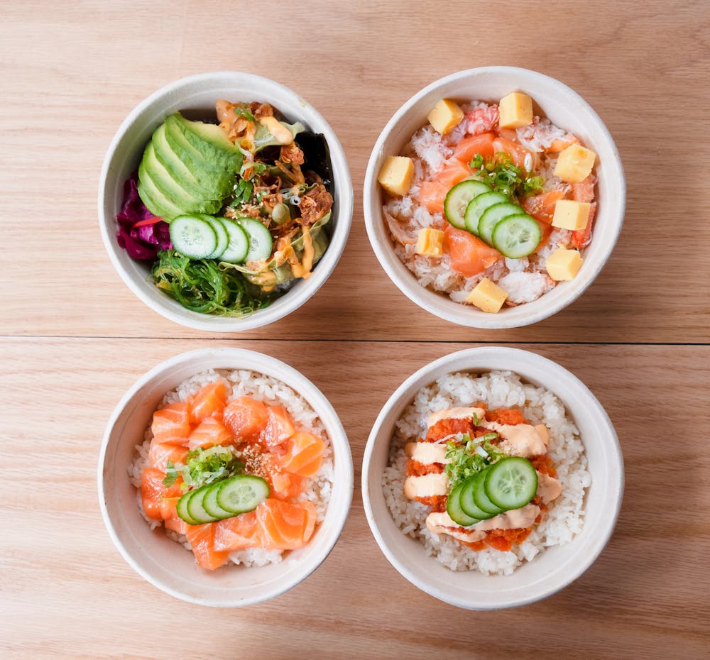 a bowl of food on a wooden table