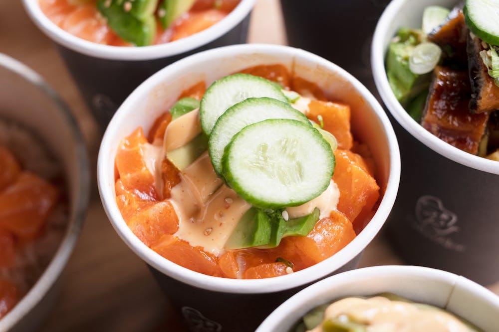 a bowl filled with different types of food on a table