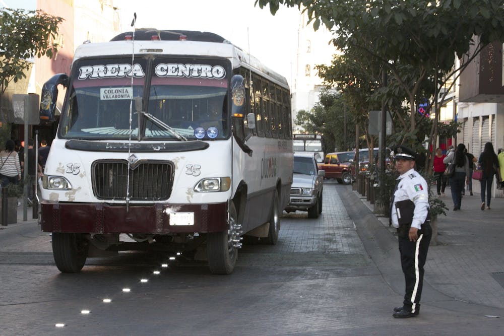 a bus driving down a city street