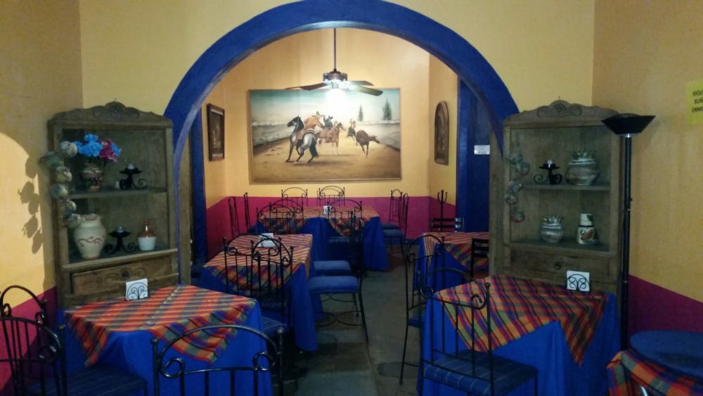 a room filled with furniture and a blue chair