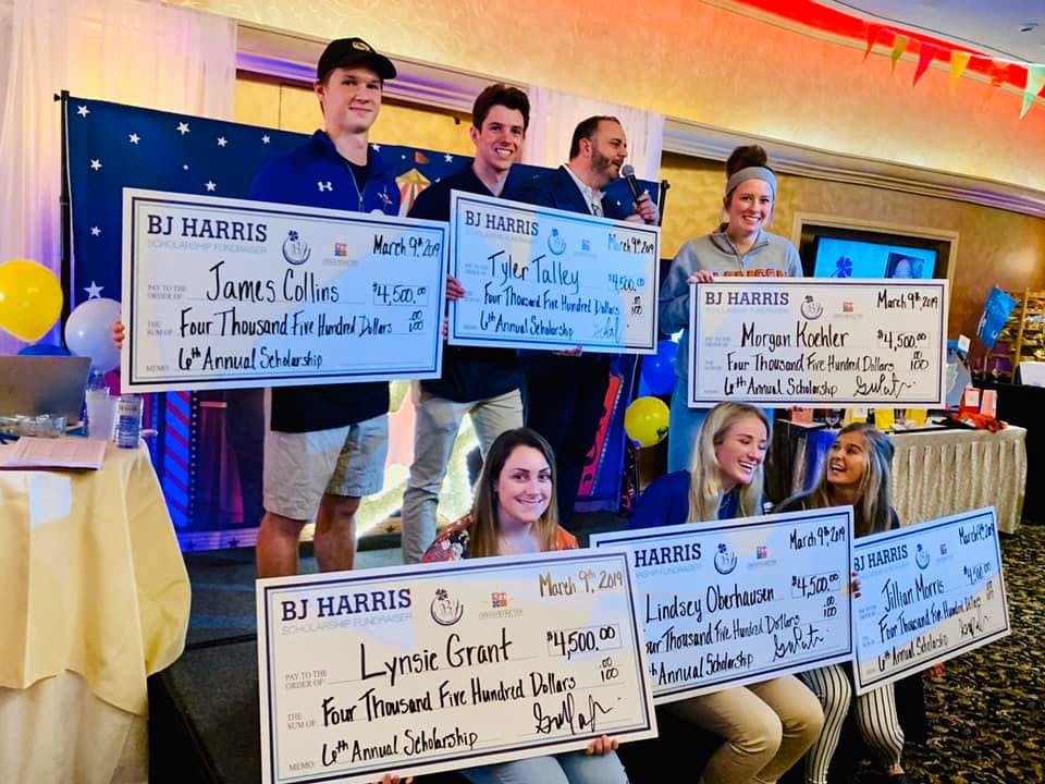 a group of people holding a sign