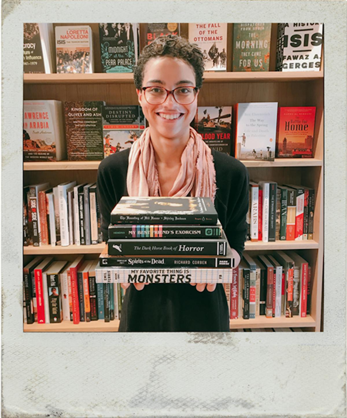 a person holding a book shelf