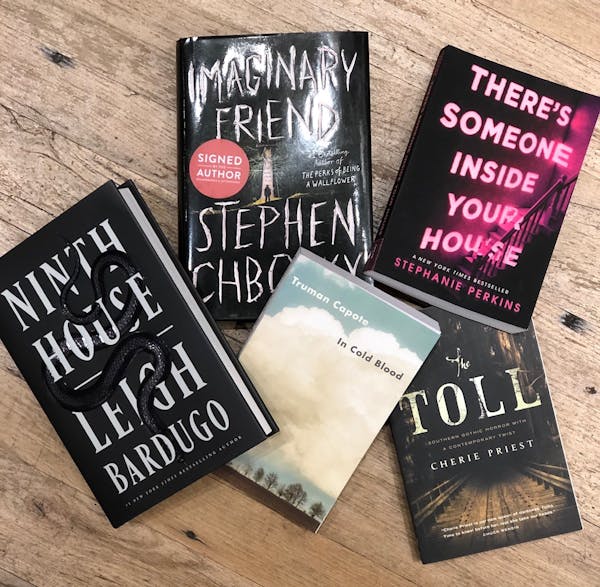 a stack of flyers on a table