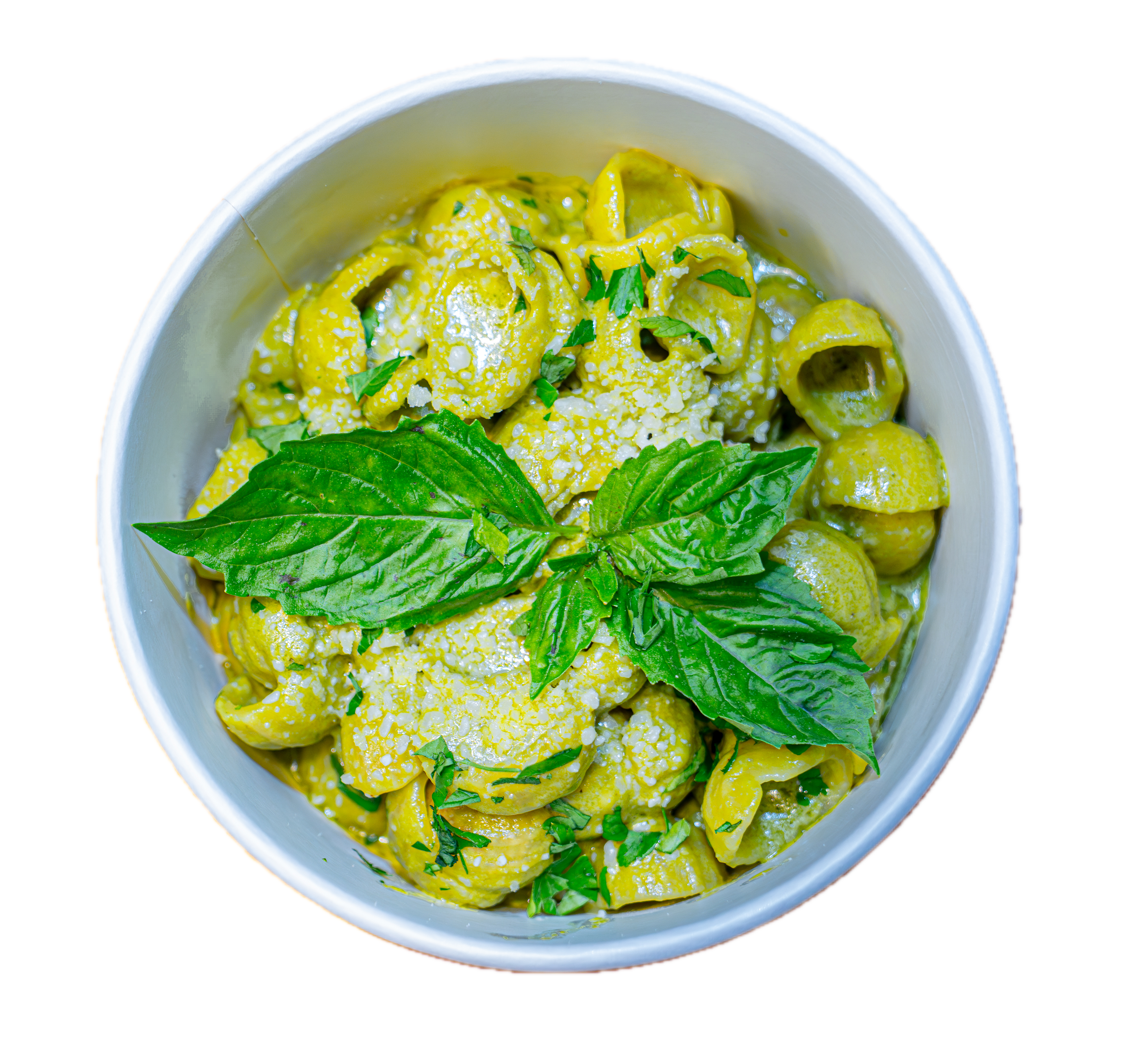 a bowl of pasta with green sauce