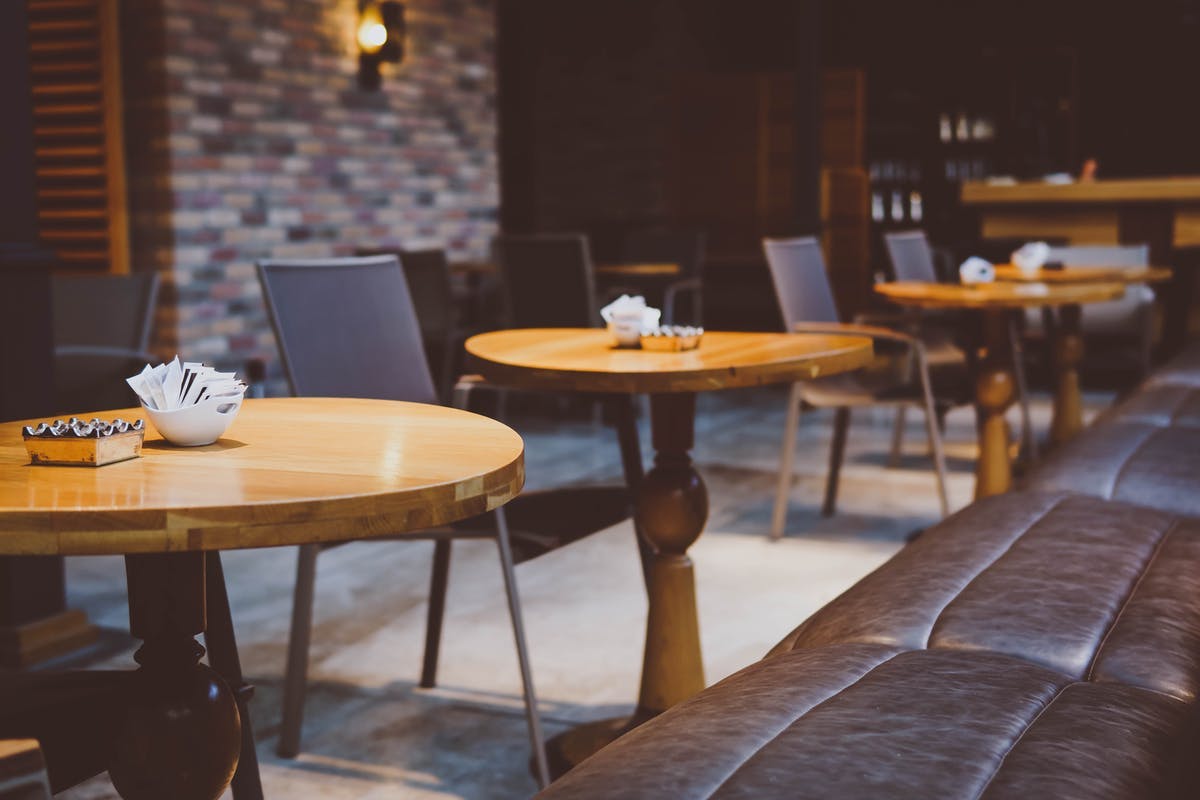 a chair sitting in front of a wooden table
