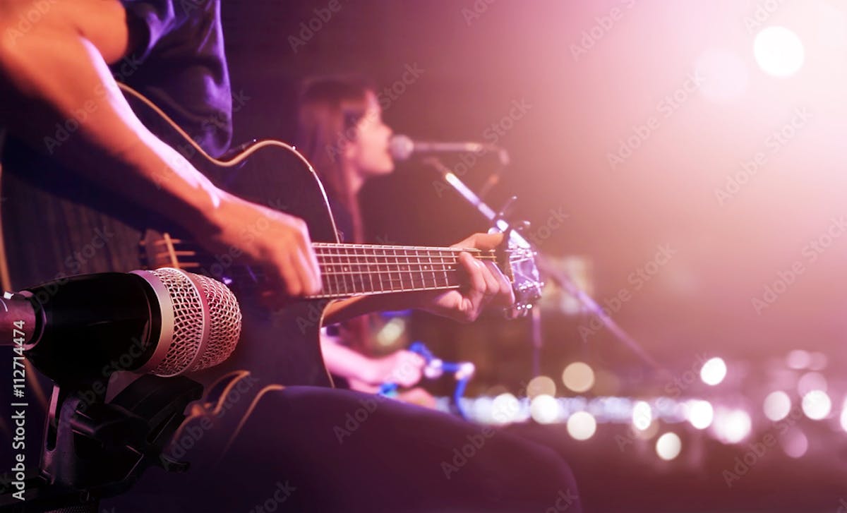 a person sitting on a stage