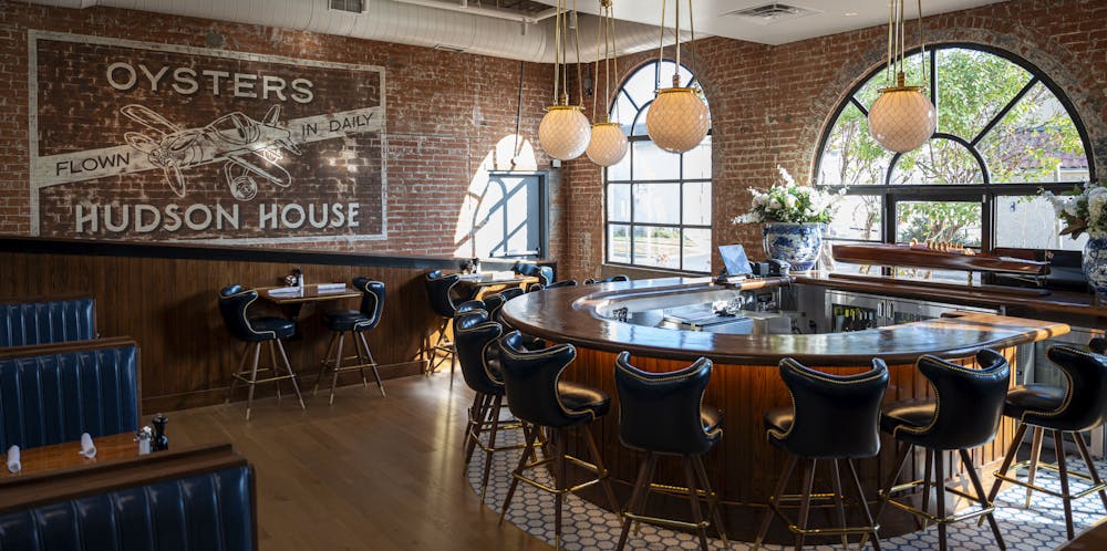 a room filled with furniture and a fire place sitting in a chair