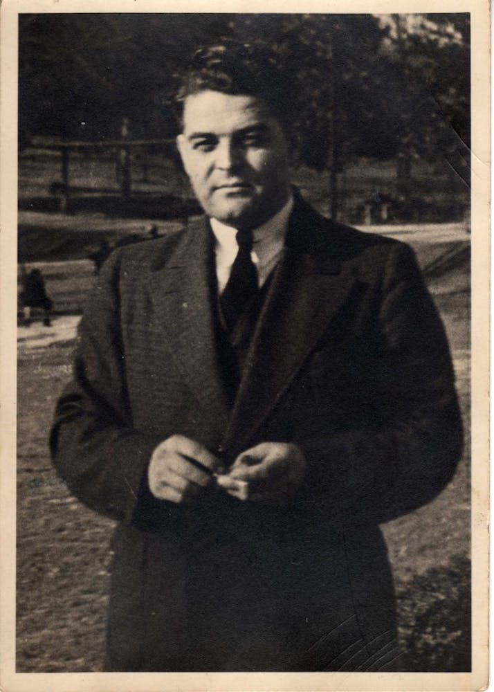 an old photo of a man in a suit and tie