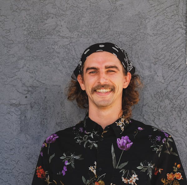 a person wearing a purple hat