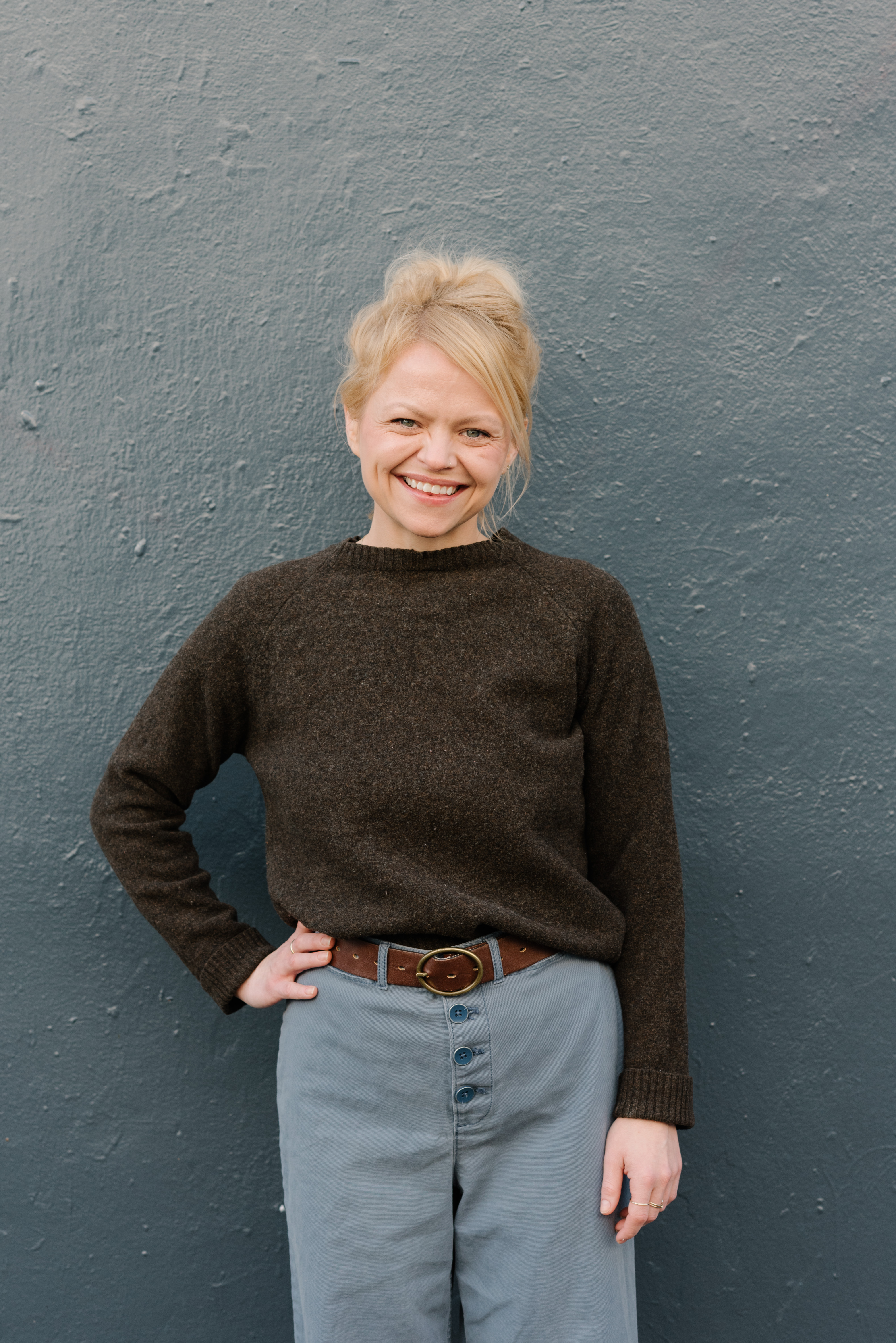 a boy standing in a parking lot