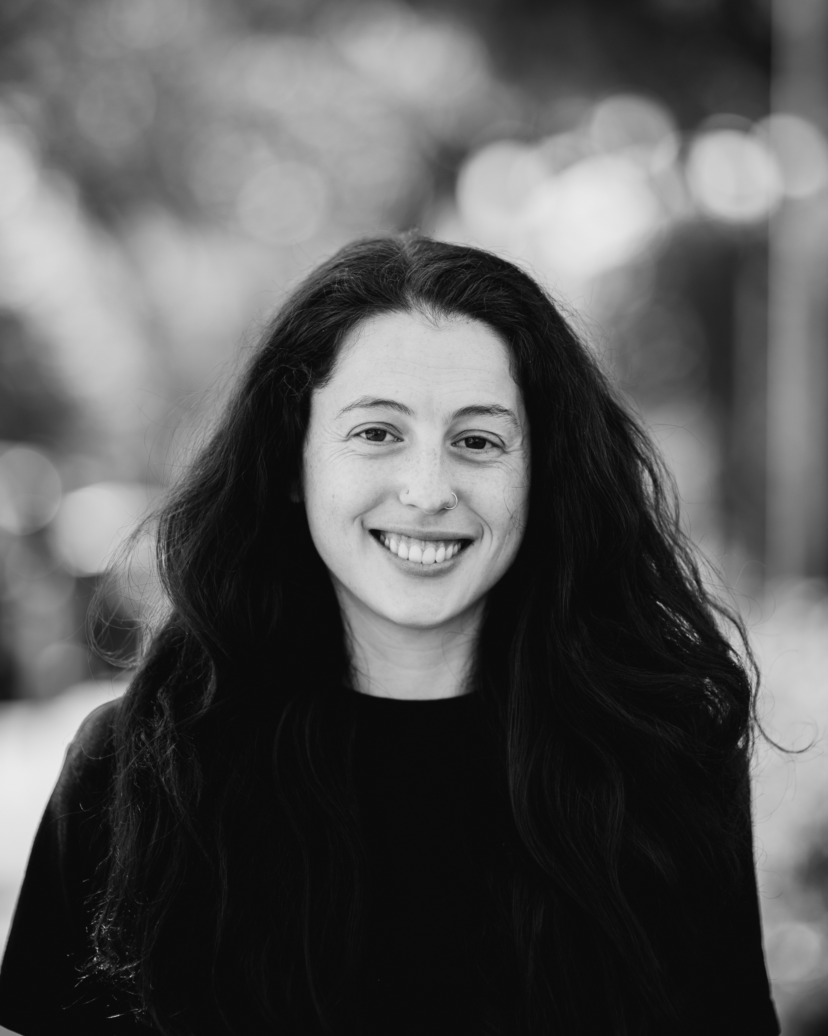 a woman with long hair smiling