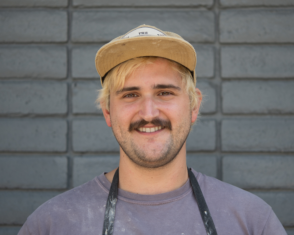 a man wearing a hat and glasses