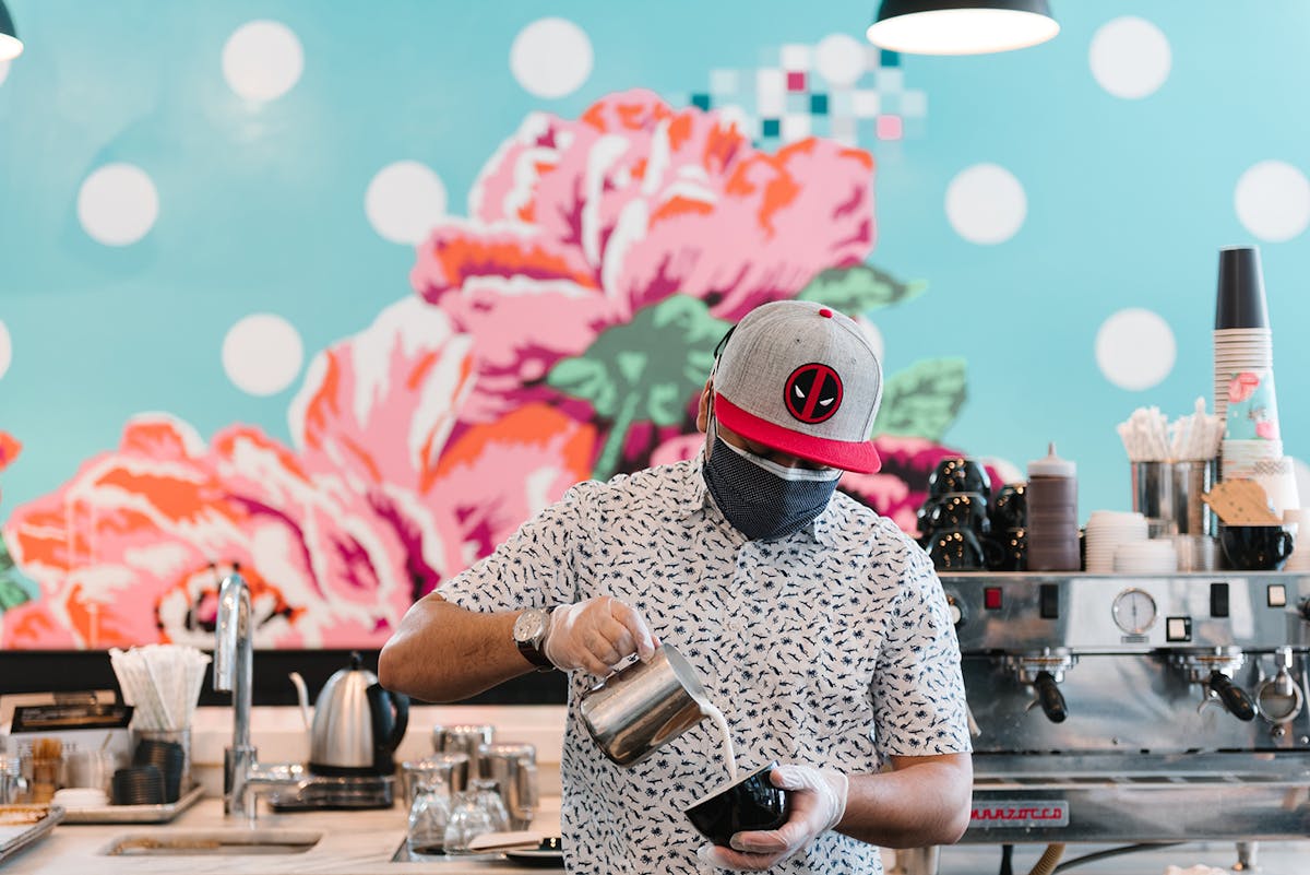 a person standing in front of a table