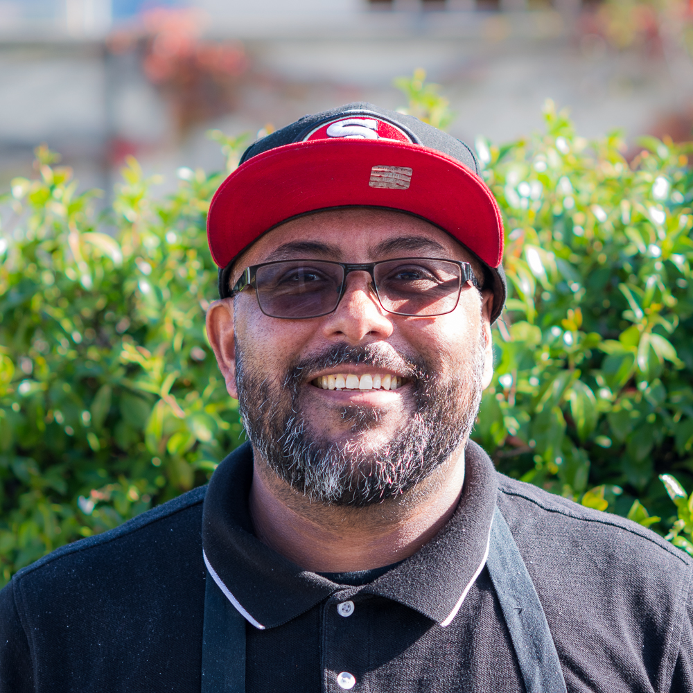 a man wearing a hat and glasses