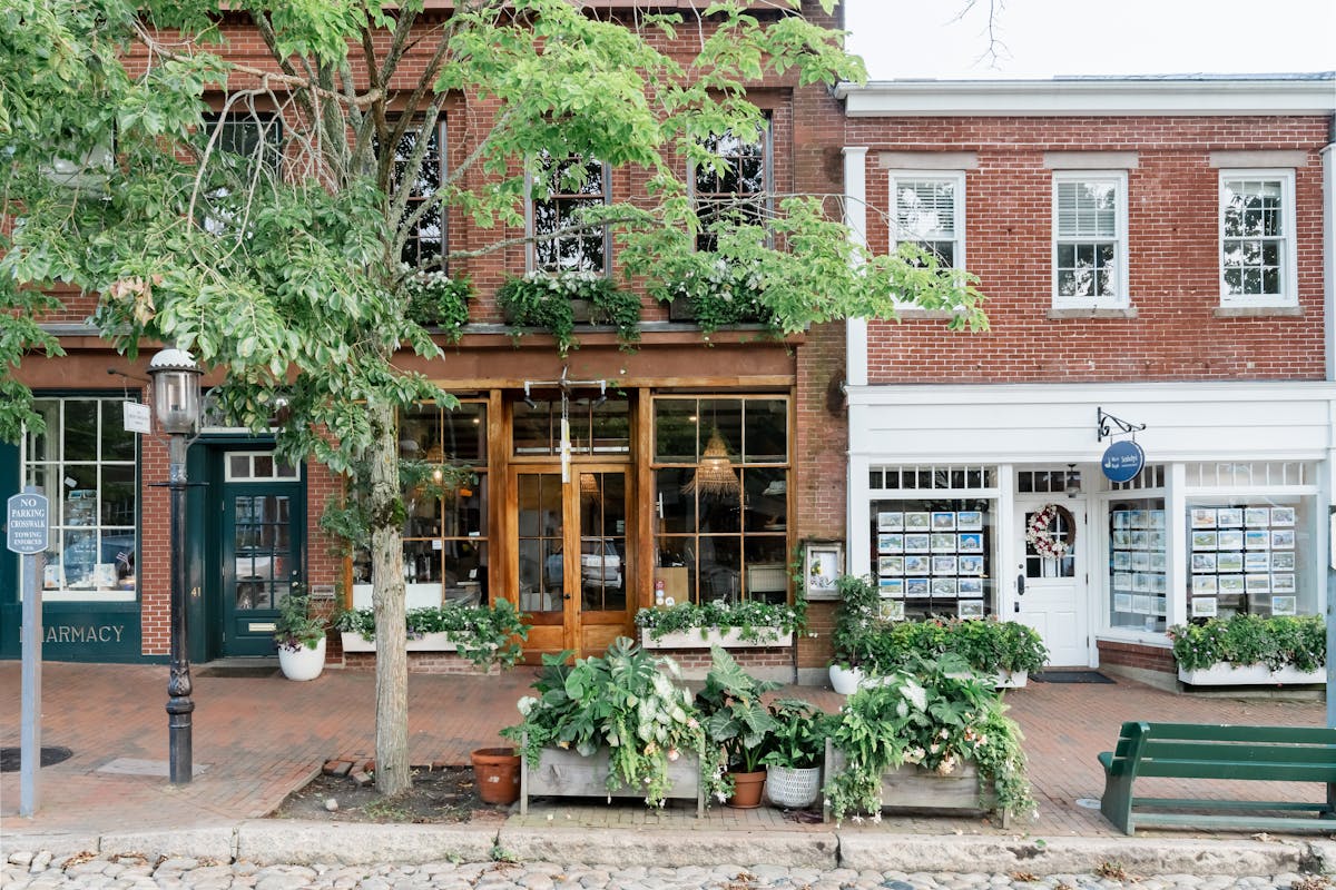 a bench in front of a brick building
